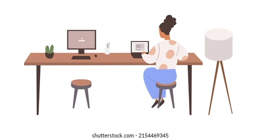 jobs in back office Woman working alone at a desk with a tablet and monitor