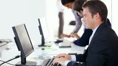 IT professional working on desktop in office