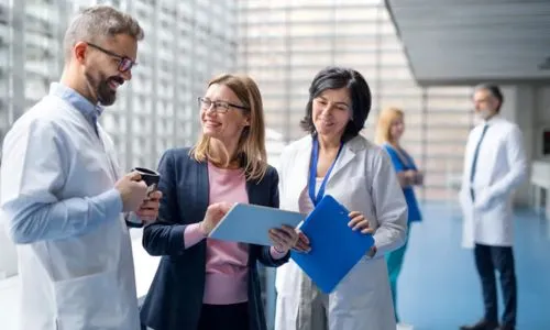 Healthcare professionals and administrator in discussion