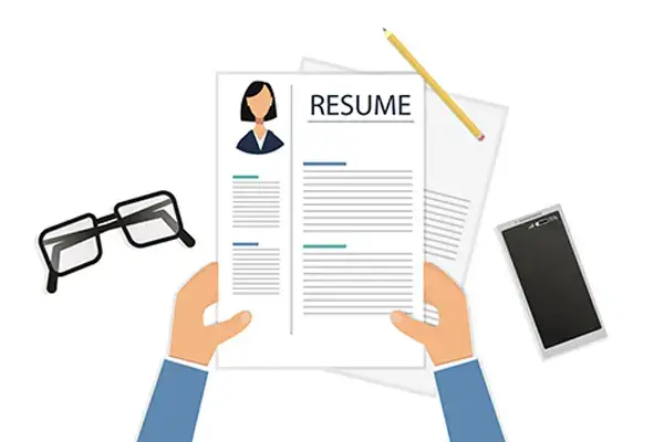 resume for freshers Hands holding a professional resume with personal items nearby